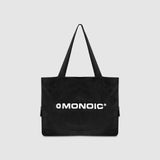 Black suede tote bag with laptop compartment and embroidered logo | MONOIC Studios bags