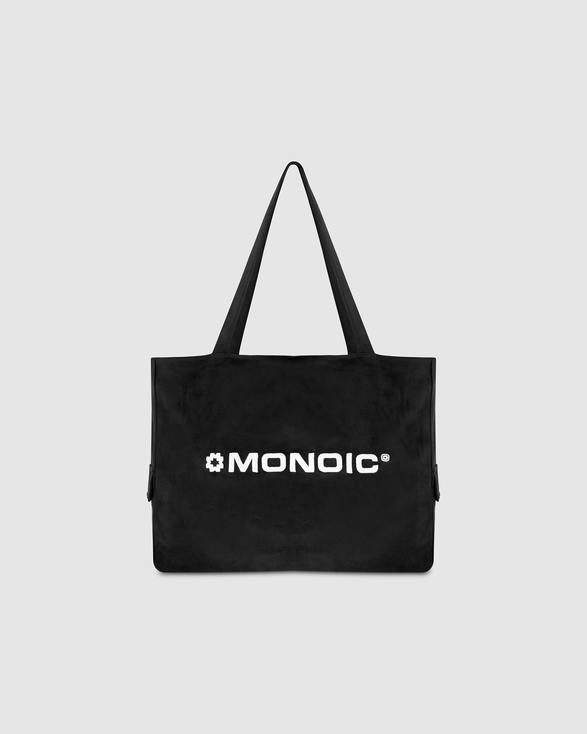 Black suede tote bag with laptop compartment and embroidered logo | MONOIC Studios bags