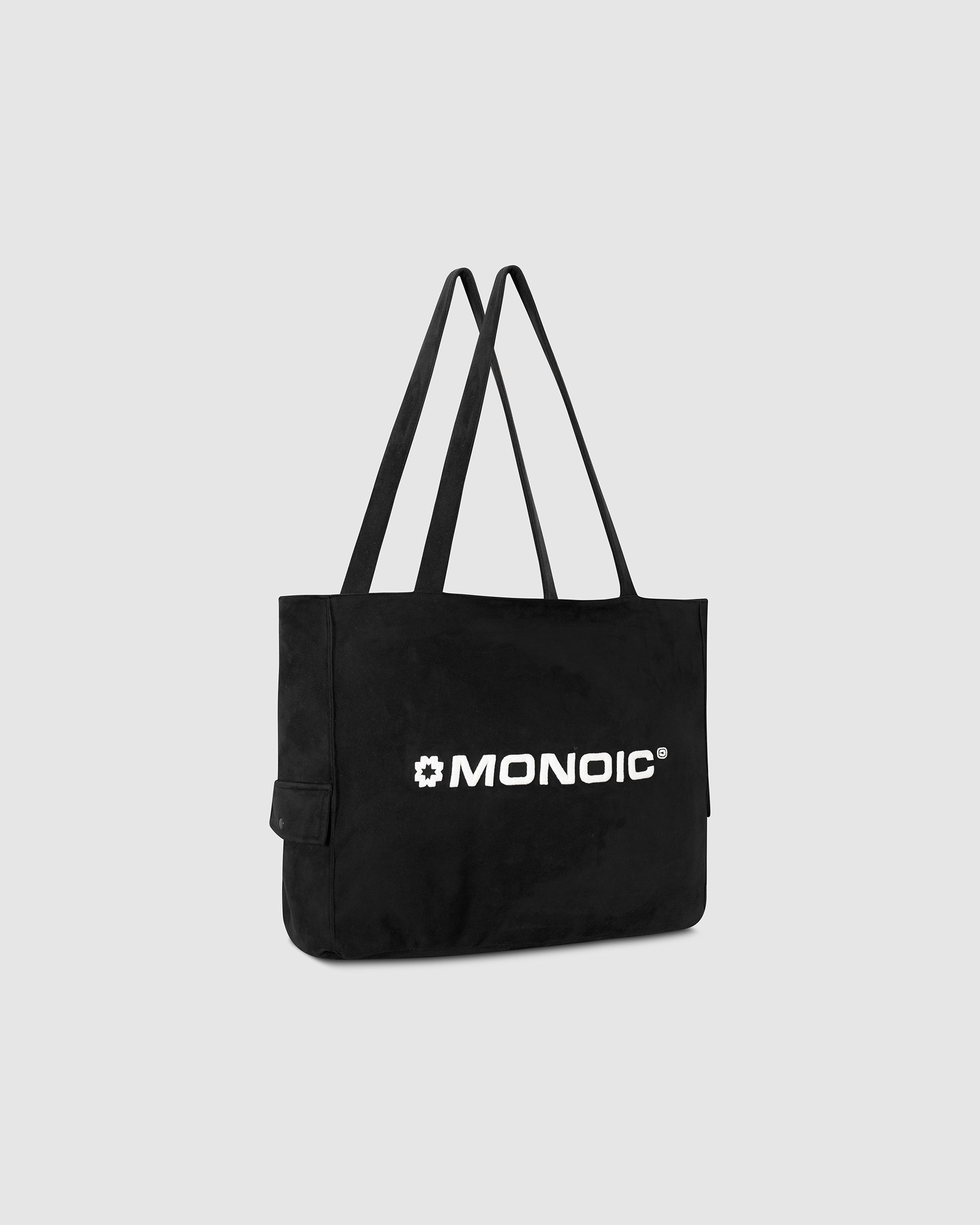 Black suede tote bag with laptop compartment and embroidered logo | MONOIC Studios bags