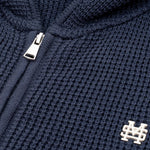 Zip Knitwear Hoodie in Navy Blue with metallic monogram, kangaroo pocket, and double zipper.