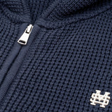 Zip Knitwear Hoodie in Navy Blue with metallic monogram, kangaroo pocket, and double zipper.