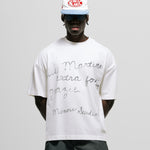 Egret White Boxy Fit T-Shirt with distressed screen-print and coffee-splatter effect, featuring woven Monoic side label.