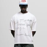Egret White Boxy Fit T-Shirt with distressed screen-print and coffee-splatter effect, featuring woven Monoic side label.