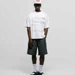 Egret White Boxy Fit T-Shirt with distressed screen-print and coffee-splatter effect, featuring woven Monoic side label.