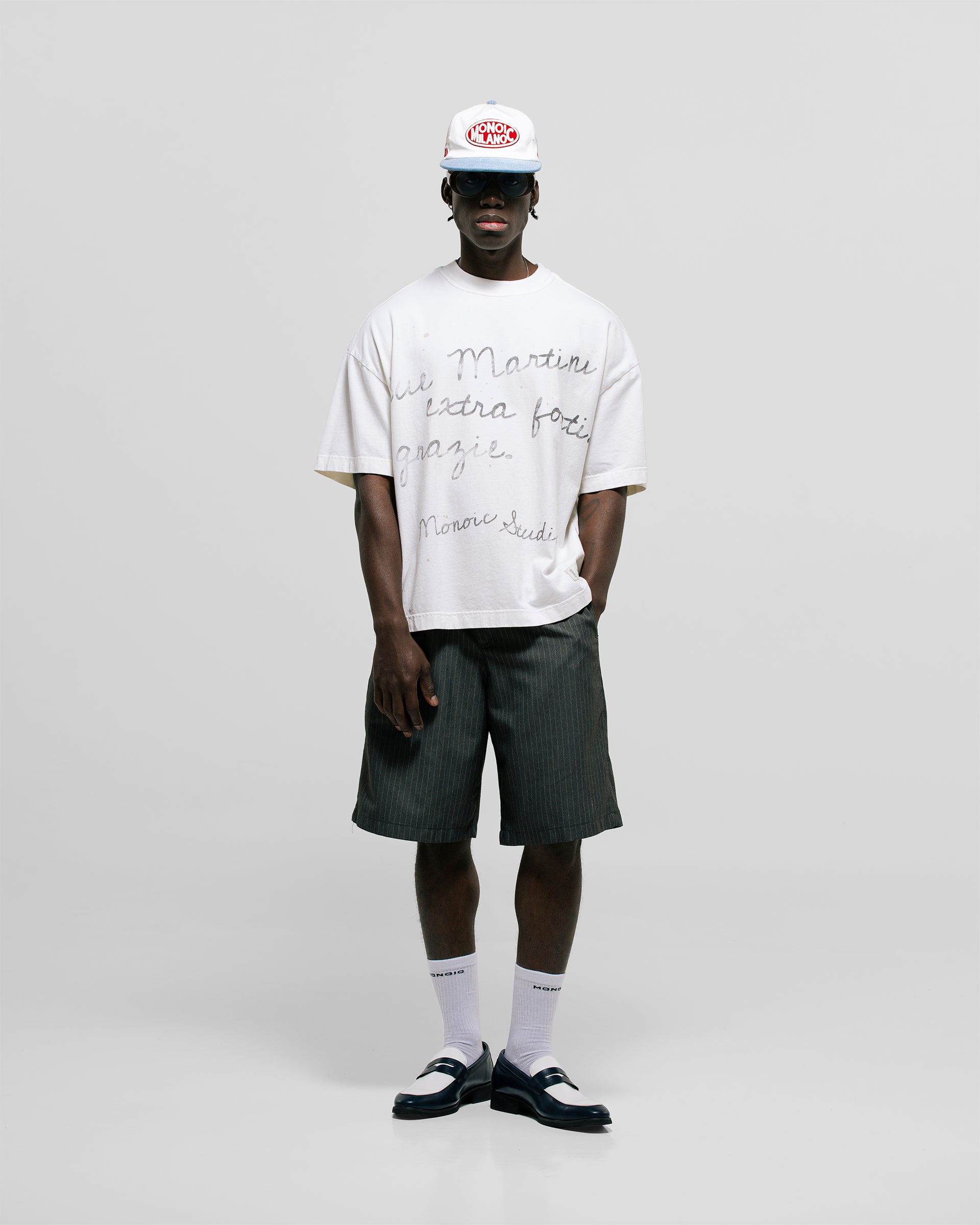 Egret White Boxy Fit T-Shirt with distressed screen-print and coffee-splatter effect, featuring woven Monoic side label.