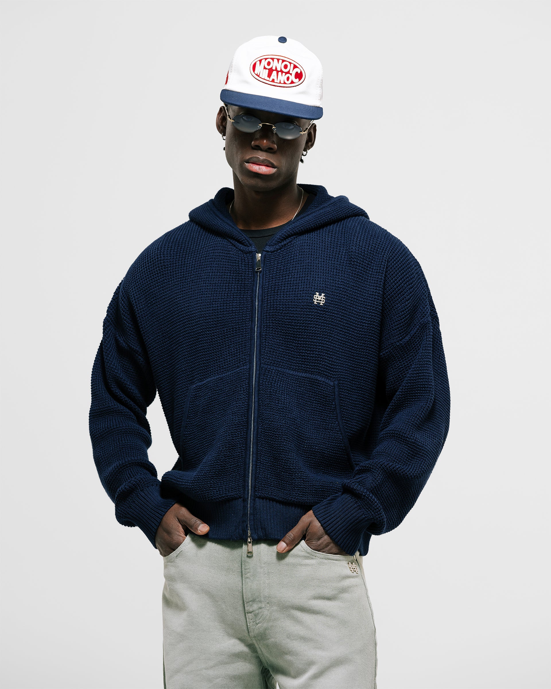 Zip Knitwear Hoodie in Navy Blue with metallic monogram, kangaroo pocket, and double zipper.