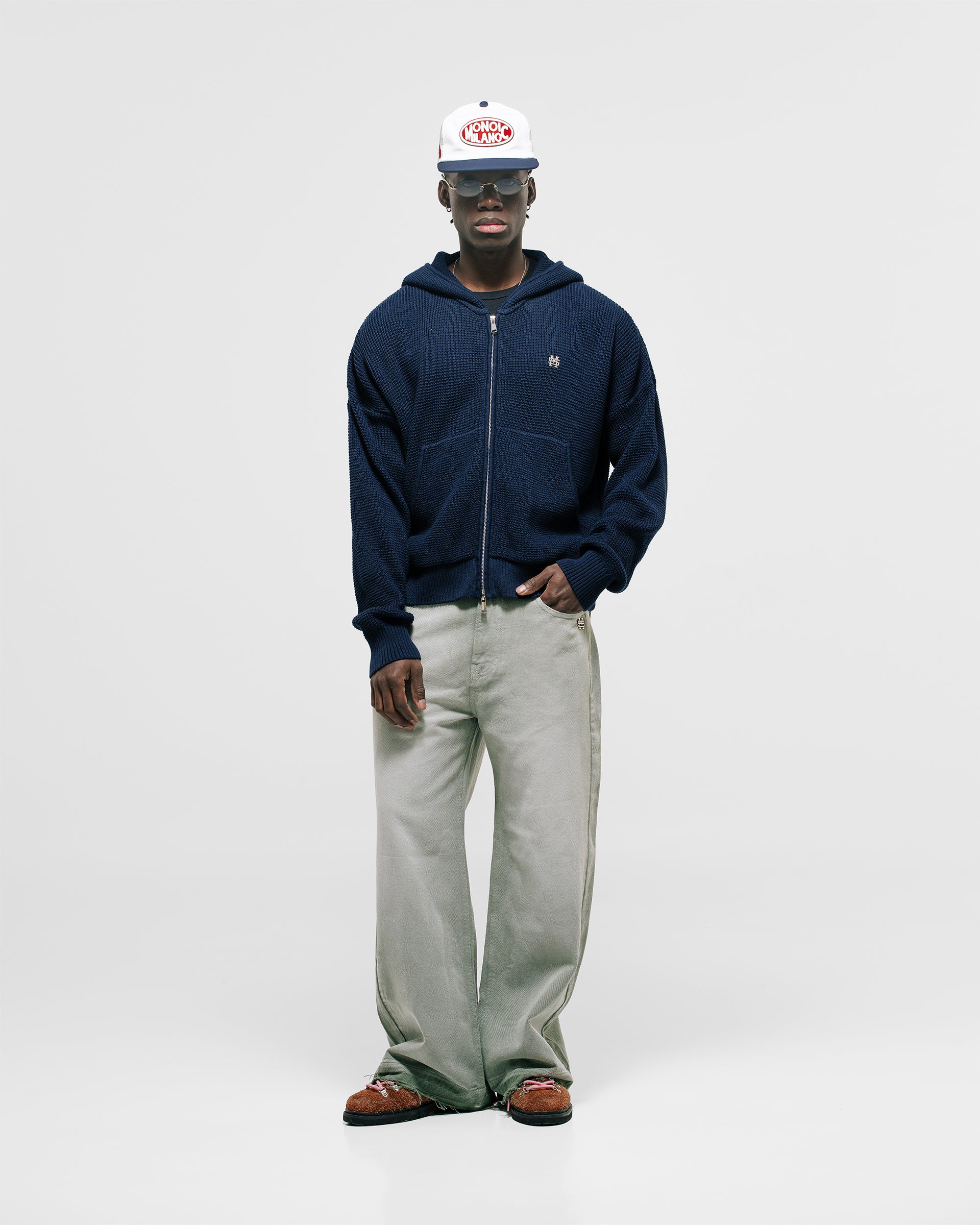Zip Knitwear Hoodie in Navy Blue with metallic monogram, kangaroo pocket, and double zipper.