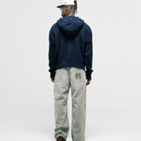 Zip Knitwear Hoodie in Navy Blue with metallic monogram, kangaroo pocket, and double zipper.